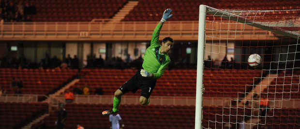 Belgium's Koen Casteels can only wave as Henri Lansbury's shot-cross finds its way into the net for England U21s